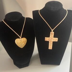 2 pendant necklaces with cloth strands.